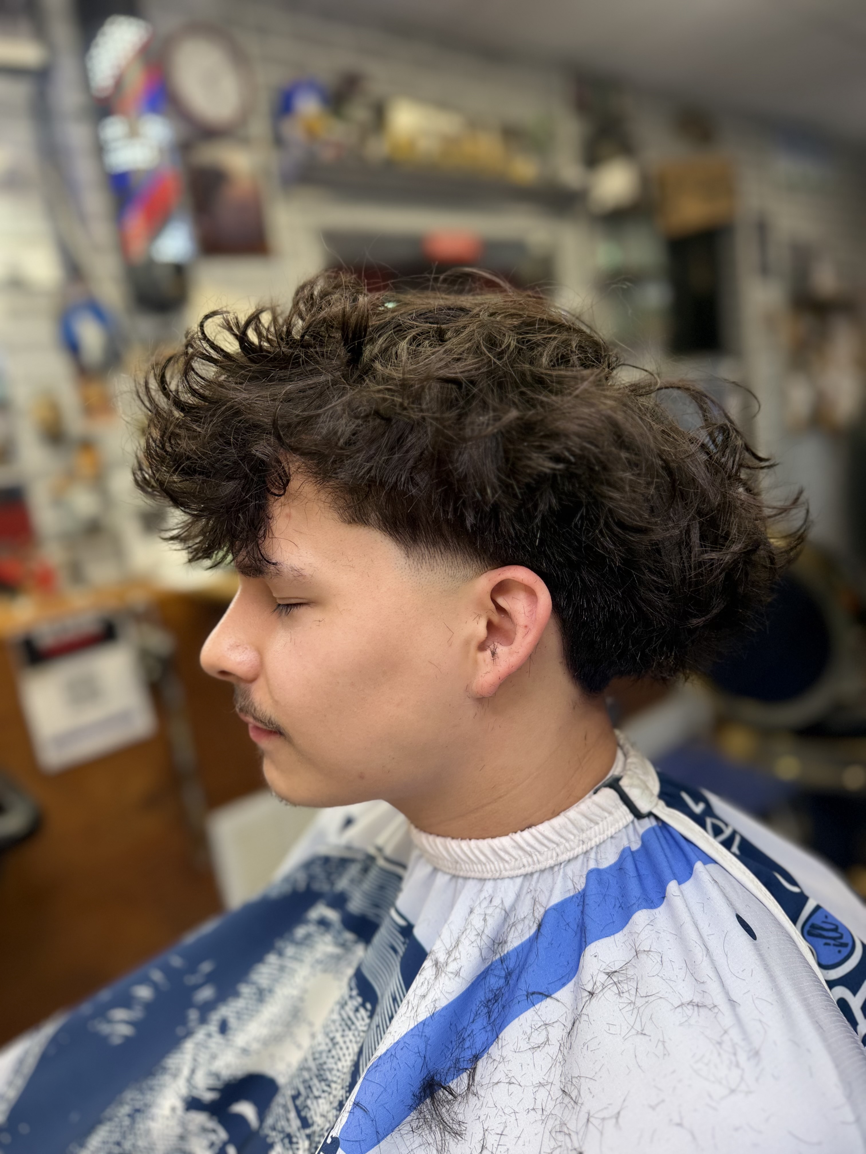 Curly taper · skin fade
