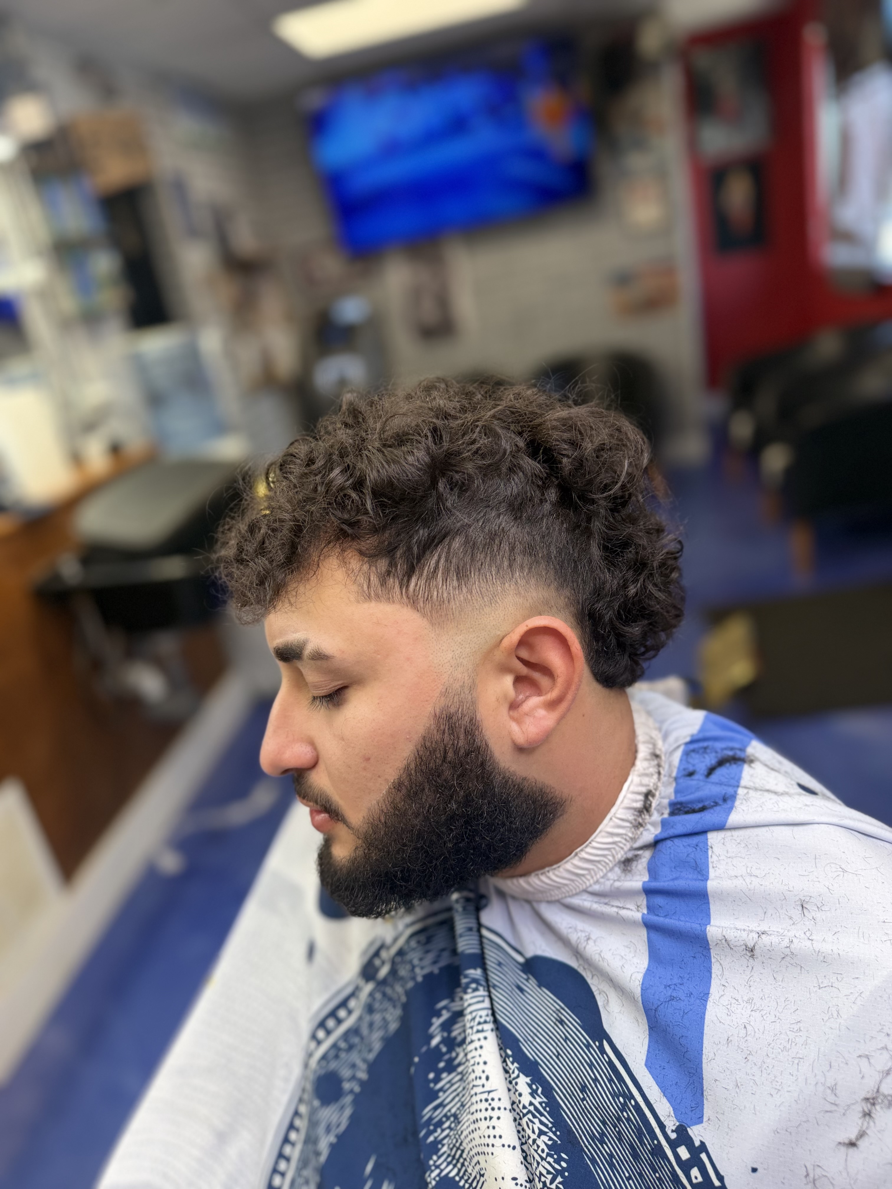 Curly crop · low fade